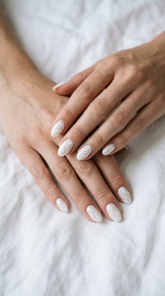 25 Stunning Short Almond Nail Ideas for 2026 to Elevate Your Style 15 Hands with swirl 202604242301