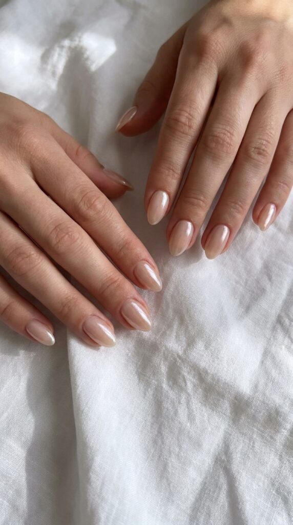 25 Stunning Short Almond Nail Ideas for 2026 to Elevate Your Style 2 Two hands with 202604242224