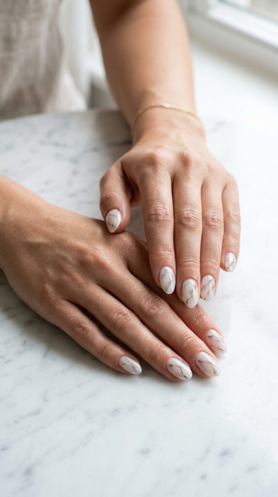 25 Stunning Short Almond Nail Ideas for 2026 to Elevate Your Style 22 Two hands with 202604242307