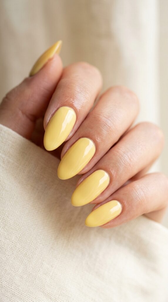 20 July Almond Nail Ideas That Hit Every Summer Trend Ideas to Elevate Your Style 12 Almond nails butter yellow polish 202605041051
