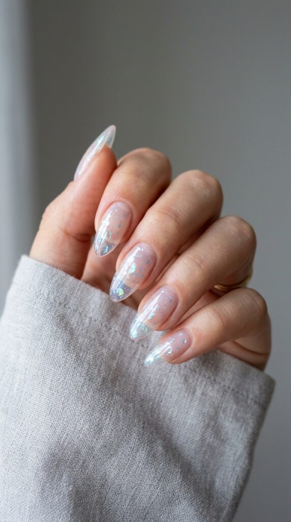 20 July Almond Nail Ideas That Hit Every Summer Trend Ideas to Elevate Your Style 16 Almond nails iridescent flakes 202605041055