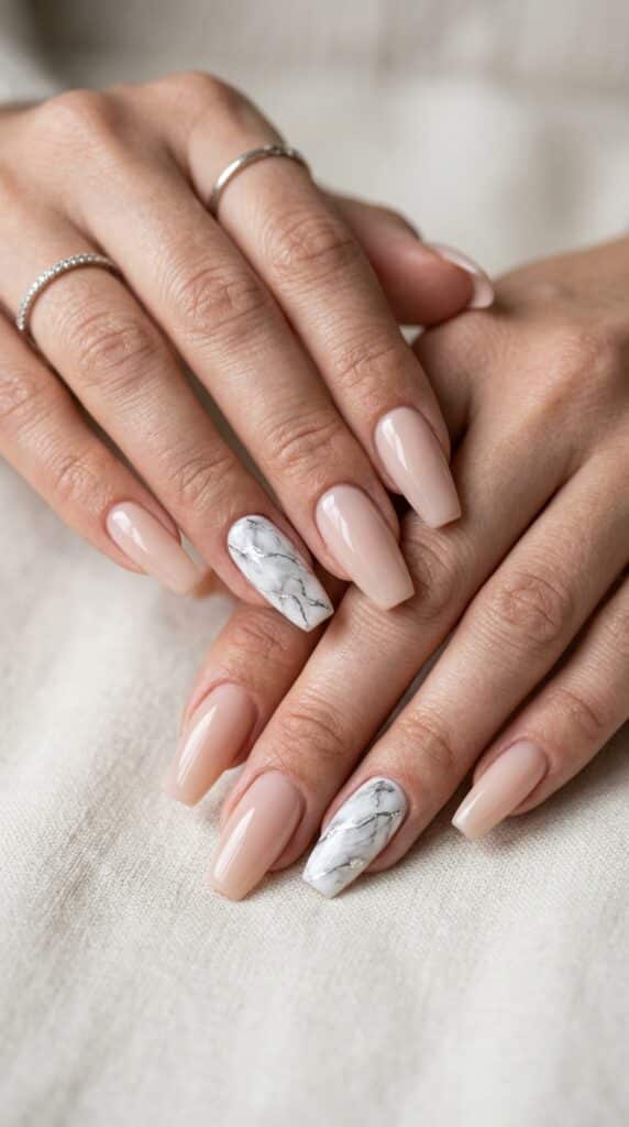 25 Chrome Nail Ideas to Elevate Your Style 21 Feminine hands with marble nails 202605031251
