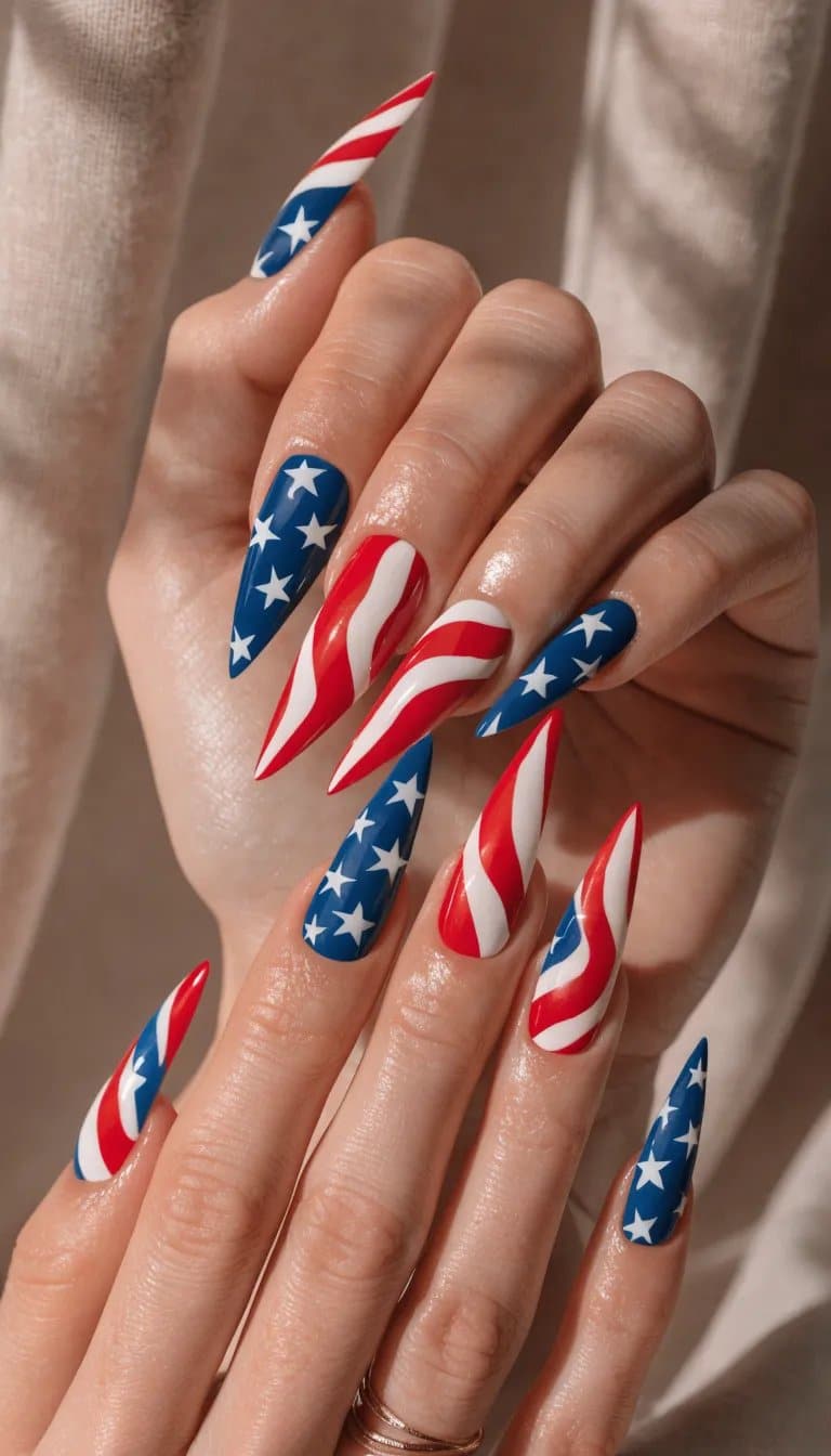 20 Stunning Red, White, and Blue Nail Art Designs for Patriotic Celebrations 13 Close-up of beautifully manicured nails featuring flag-inspired red, white, and blue designs.