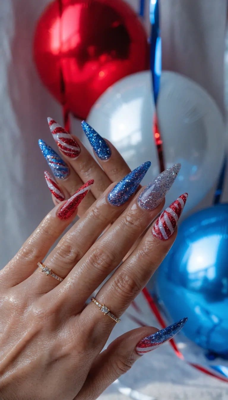 Nail design featuring red, white, and blue glittery accents for the 4th of July.