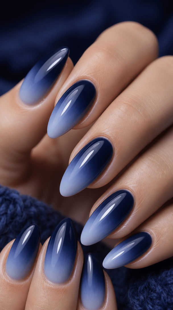 Elegant navy blue ombre nails in almond shape